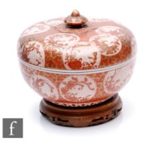 A Japanese Kutani lidded bowl of circular form, the exterior decorated with iron red and gilt fan