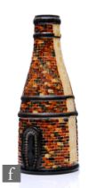 A Moorcroft Pottery vase modelled as a bottle kiln designed by Rob Tabbenor, printed and painted