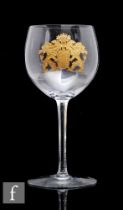 A large Stevens & Williams drinking glass, the ovoid bowl engraved and gilded with a large