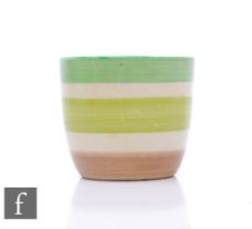 A Clarice Cliff Bizarre pattern egg cup, green and brown banded design, height 4cm.