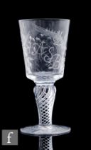 An early 20th Century clear crystal drinking glass, the bucket form bowl engraved with an 18th