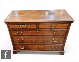 A 19th Century oak and mahogany crossbanded straight front chest of two short and three long
