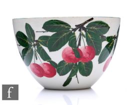 A Wemyss ware bowl painted with cherries and green leaves on a white ground, impressed mark to base,