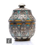 A Moroccan pottery urn, the sectional pottery urn, picked out in green and yellow enamels and