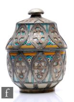 A Moroccan pottery urn, the sectional pottery urn, picked out in green and yellow enamels and