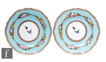 A pair of late 19th Century Spode porcelain plates, the central well decorated with a hand enamelled