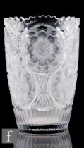 A large continental clear crystal glass vase of tumbler form decorated with repeat circular panels