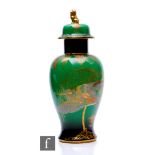 A large 1930s Carlton Ware temple jar decorated in the Sketching Bird pattern by Violet Elmer