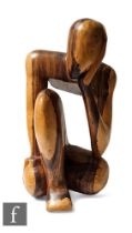 A 20th Century carved and polished hardwood  study of a resting thinking man, height 45cm.