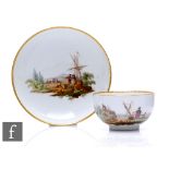 A late 18th Century Meissen porcelain tea cup and saucer, the circular cup with loop handle, hand