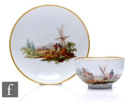 A late 18th Century Meissen porcelain tea cup and saucer, the circular cup with loop handle, hand