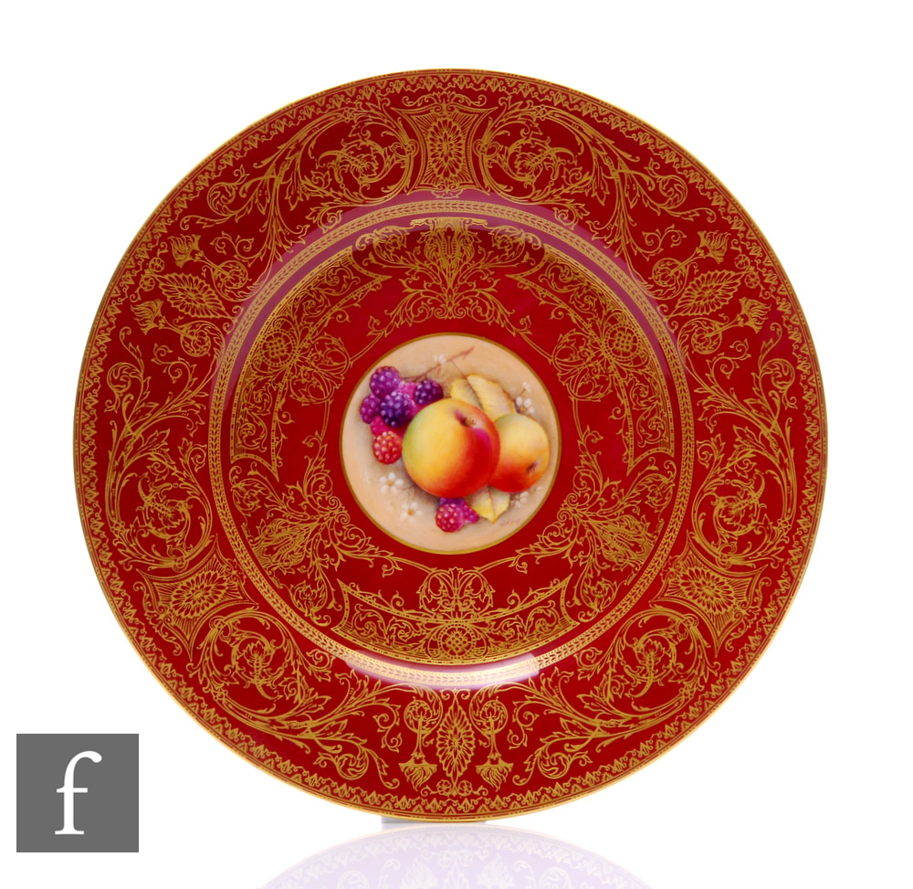 A later 20th Century Royal Worcester Fallen Fruits cabinet plate, the central round hand enamelled