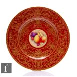 A later 20th Century Royal Worcester Fallen Fruits cabinet plate, the central round hand enamelled