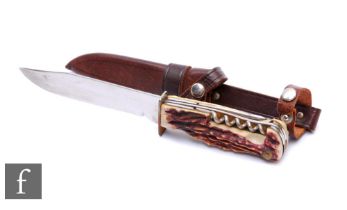 A 20th Century Black Forest hunting knife, 12.5cm blade, carved horn handle one side depicting a