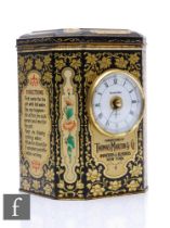 A vintage tea caddy with lithograph printed design by Thomas Martin & Co, mounted with a clock