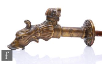 An Edwardian brass tap with medieval stylised spout in the form of a beast's head, width 18cm.