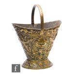 A 20th Century or earlier Renaissance style brass coal bucket with fixed handle, grotesque masks