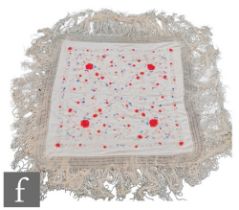 A 1920s Chinoiserie embroidered Manila (or piano) shawl, the ivory silk ground with red, pink,
