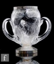 An early 20th Century Stevens & Williams clear crystal three handled tyg with rock crystal style