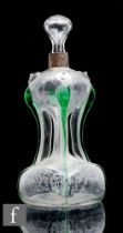 A late 19th Century Stevens & Williams Scrooge decanter in clear crystal with applied green