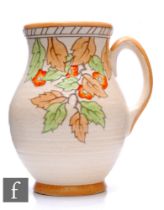 A 1930s Crown Ducal flower jug by Charlotte Rhead in the Golden Leaves pattern with tubelined