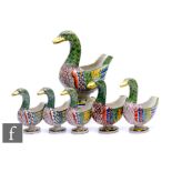 A graduated set of six early 20th Century Quimper faience ducks, each modelled as a stylised duck