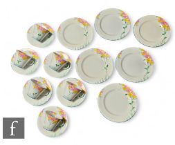 An Aynsley part floral tea set painted with spring flowers on a white ground, comprising six tea