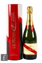 A bottle of G.H. Mumm champagne, with Formula 1 official tin, unopened.