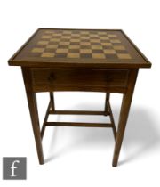 A late 20th Century bespoke walnut and beech games table, the square chequer board top over a frieze