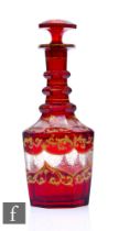 A 19th Century Bohemian spirit decanter of hexagonal form, cased in ruby over clear crystal with