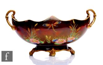 A 1930s Carlton Ware Gondola bowl with arched handles decorated in the Dragon Fly pattern, with