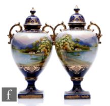A large pair of early 20th Century Noritake pedestal vases, each with a square foot and socle base