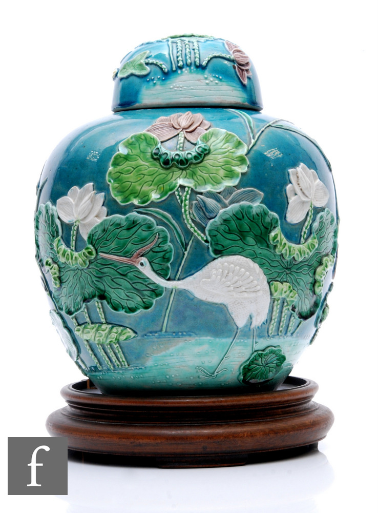 A Chinese late Qing Dynasty relief moulded jar and cover, in the style of Wang Bing Rong,