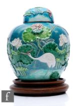 A Chinese late Qing Dynasty relief moulded jar and cover, in the style of Wang Bing Rong,