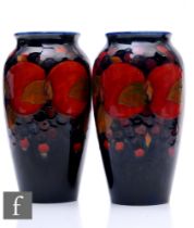 A pair of early 20th Century William Moorcroft Pottery vases of shouldered ovoid form with everted