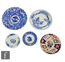A collection of Chinese and Japanese dishes, to include two 18th Century Chinese blue and white