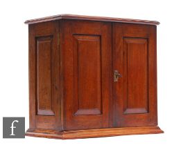 An Edwardian mahogany smoker's cabinet, the interior fitted with two drawers and divisions