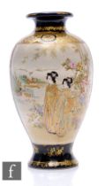 A Japanese Meiji period (1868-1912) satsuma vase of rounded form, decorated with bijin before a