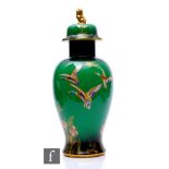 A large 1930s temple jar and cover decorated in the Mallard pattern with birds in flight over a
