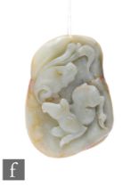 A Chinese Qing Dynasty jade pebble carving, the smooth pale green and russet stone, carved in relief