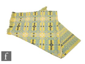 A vintage woollen Welsh tapestry black, yellow and turquoise fringed edge blanket or carthen,