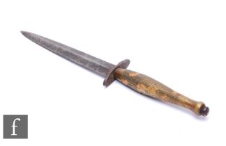 A World War Two Fairbairn Sykes fighting knife, 15.5cm blade, second pattern, chequered brass grip.
