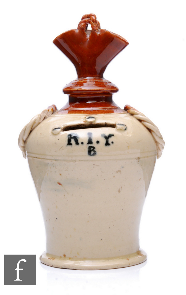 A 19th Century stoneware money box of shouldered ovoid form with narrow collar neck and flared