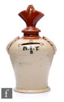 A 19th Century stoneware money box of shouldered ovoid form with narrow collar neck and flared