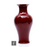 A Chinese Kangxi style Sang-de-boeuf vase, of meiping form, the body with all over rich red glaze,