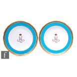 A pair of late 19th Century Minton porcelain plates, each decorated to the central well with a