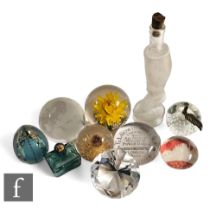 A collection of 20th Century and later assorted glass paperweights, to include a facet cut