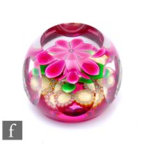 A later 20th Century Perthshire glass paperweight, of domed form with facet cut sides and top,