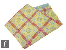 A vintage woollen Welsh tapestry pale blue, yellow and deep pink fringed edge blanket or carthen,