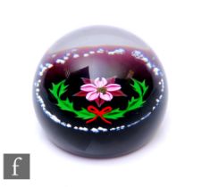 A later 20th Century William Manson for Caithness glass paperweight, of domed form, in the Noel